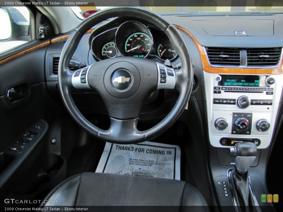 Ebony Interior Dashboard for the 2009 Chevrolet Malibu LT Sedan #66830027