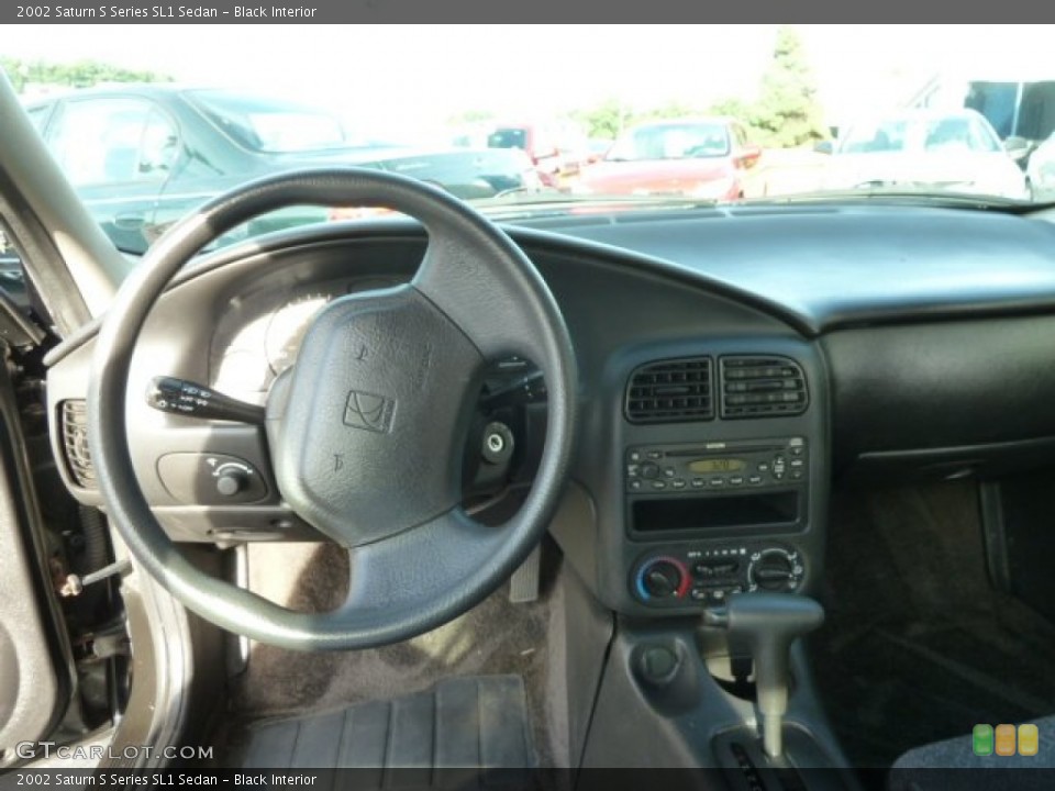 Black Interior Dashboard for the 2002 Saturn S Series SL1 Sedan #67057830