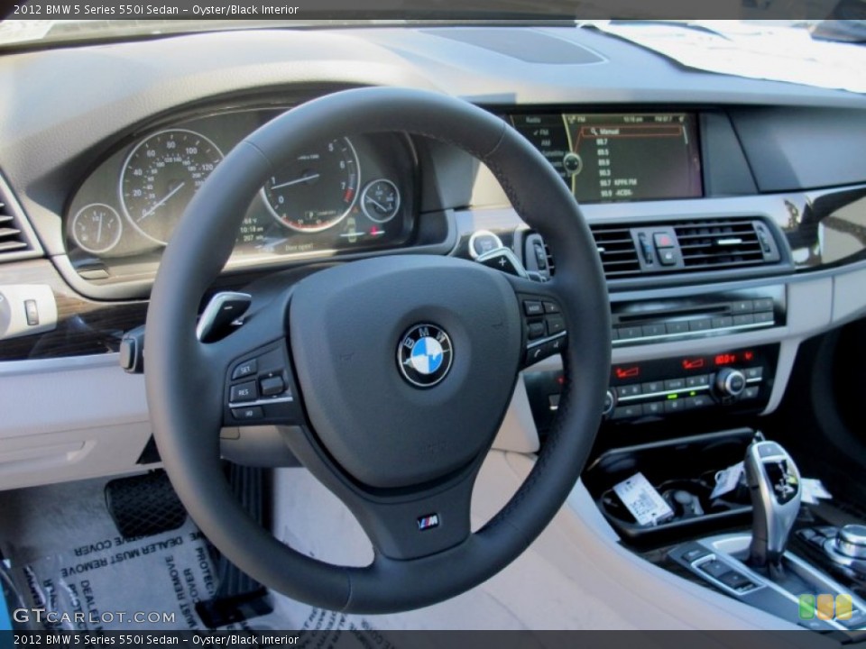 Oyster/Black Interior Steering Wheel for the 2012 BMW 5 Series 550i Sedan #67163780