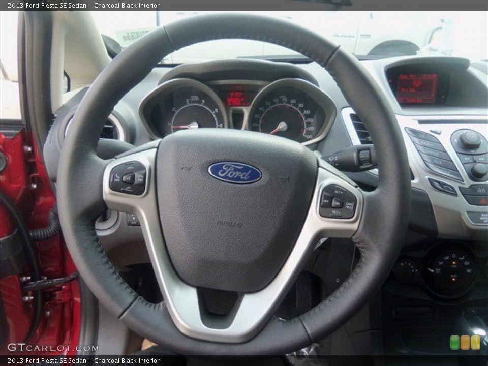 Charcoal Black Interior Steering Wheel for the 2013 Ford Fiesta SE Sedan #67505264