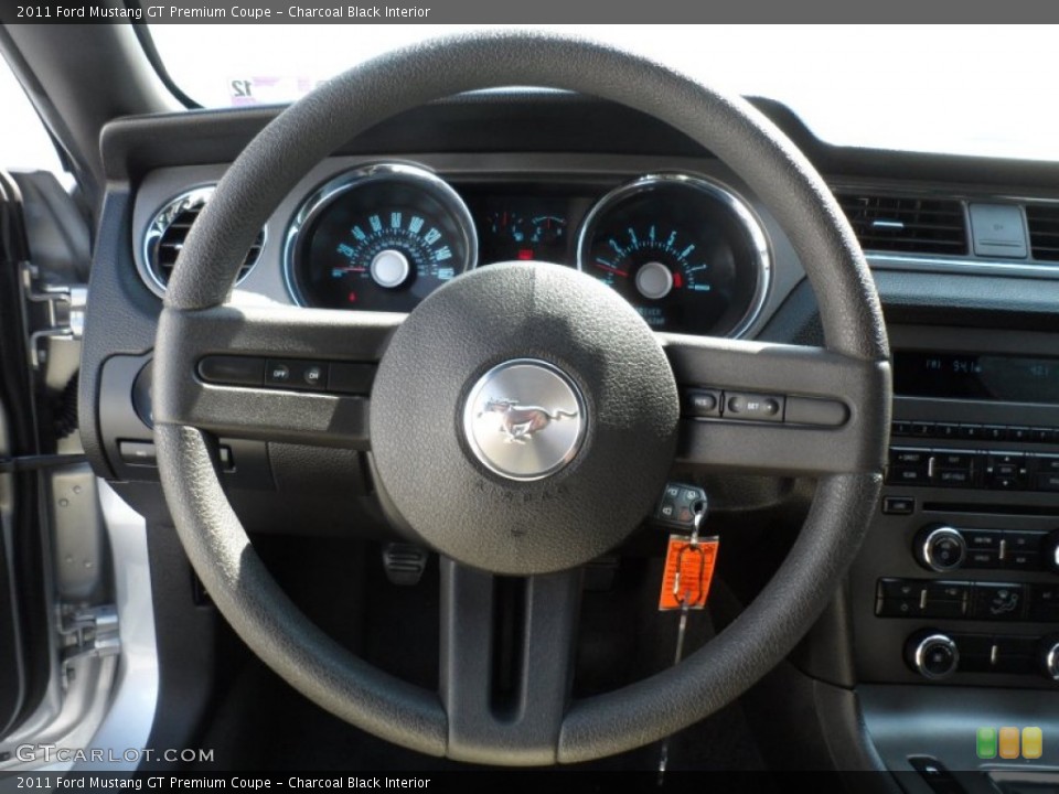 Charcoal Black Interior Steering Wheel for the 2011 Ford Mustang GT Premium Coupe #67683166