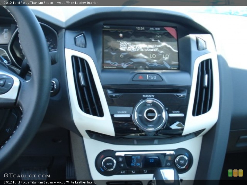 Arctic White Leather Interior Controls for the 2012 Ford Focus Titanium Sedan #67793640