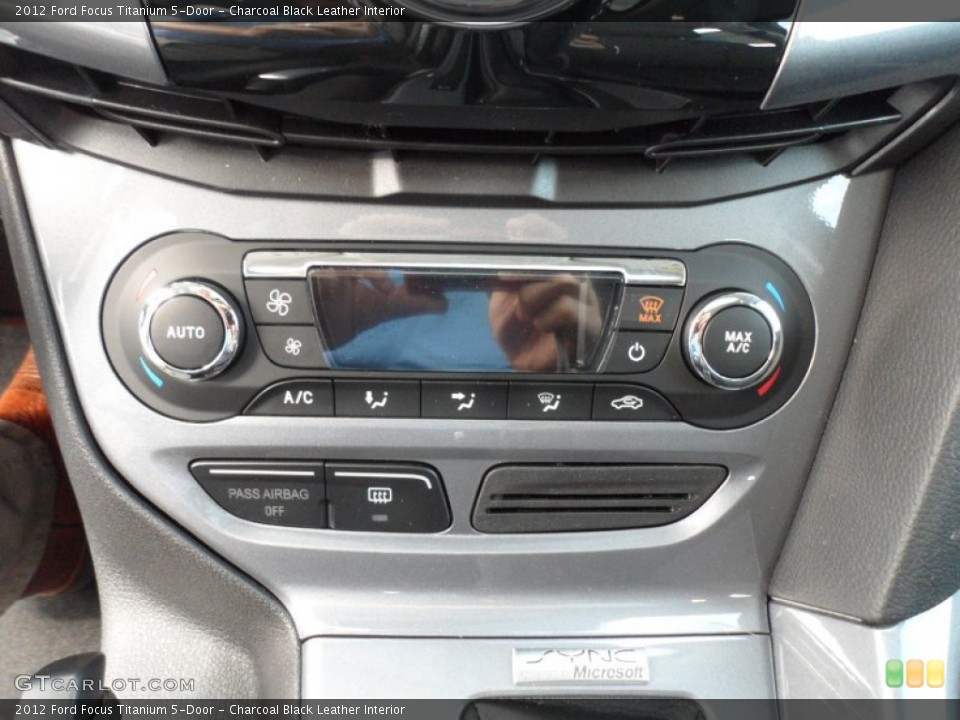 Charcoal Black Leather Interior Controls for the 2012 Ford Focus Titanium 5-Door #67812956