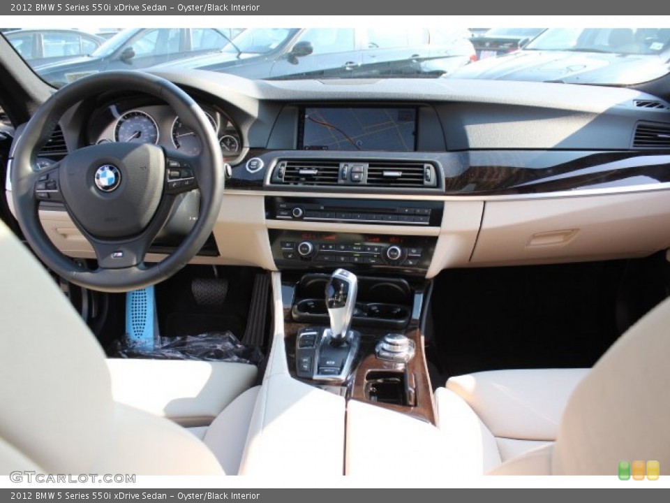 Oyster/Black Interior Dashboard for the 2012 BMW 5 Series 550i xDrive Sedan #67979456