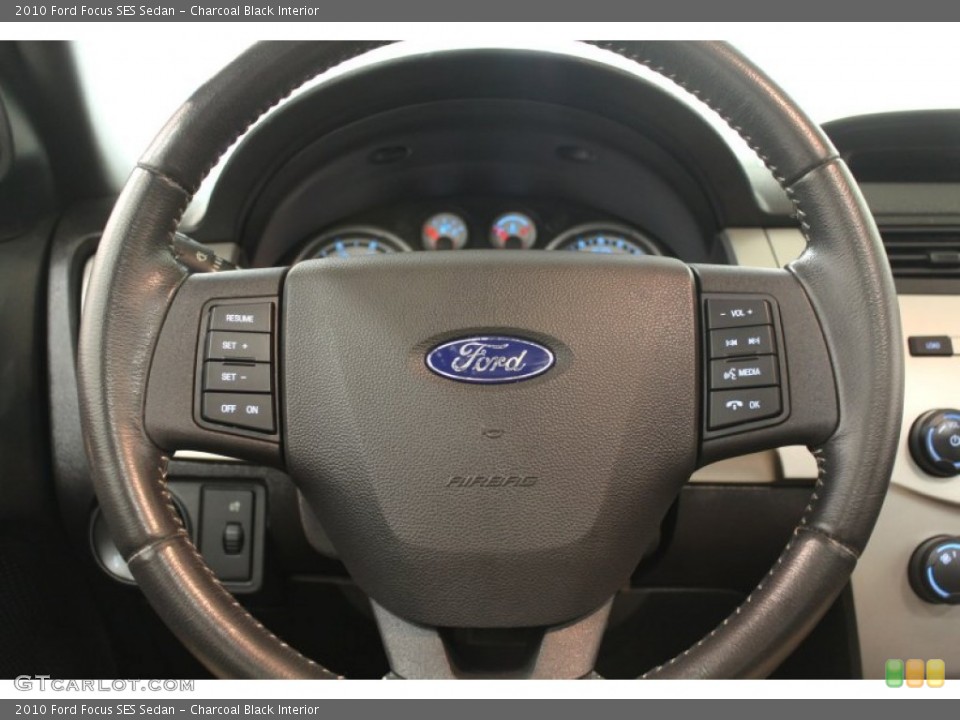 Charcoal Black Interior Steering Wheel for the 2010 Ford Focus SES Sedan #68011748