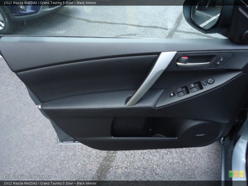 Black Interior Door Panel for the 2012 Mazda MAZDA3 i Grand Touring 5 Door #68102497