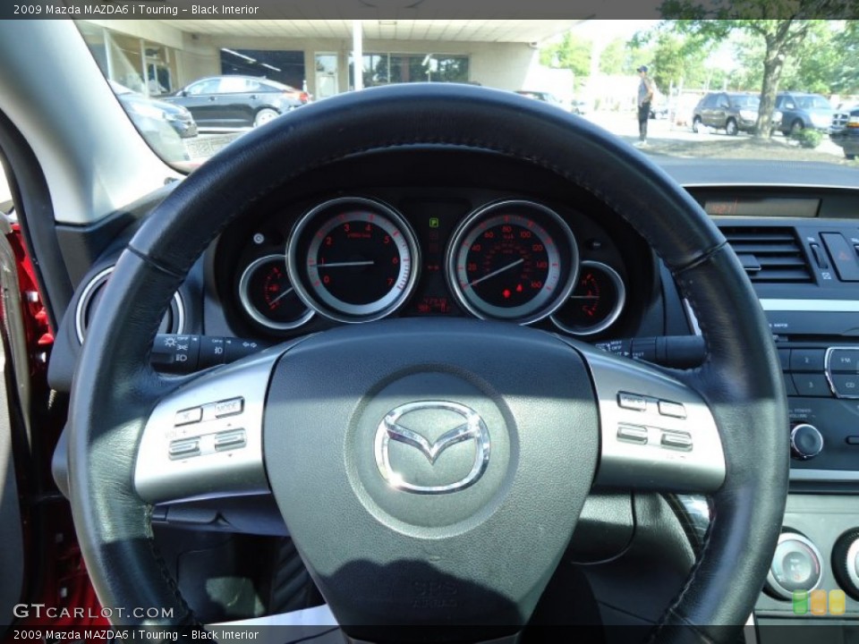 Black Interior Steering Wheel for the 2009 Mazda MAZDA6 i Touring #68410757