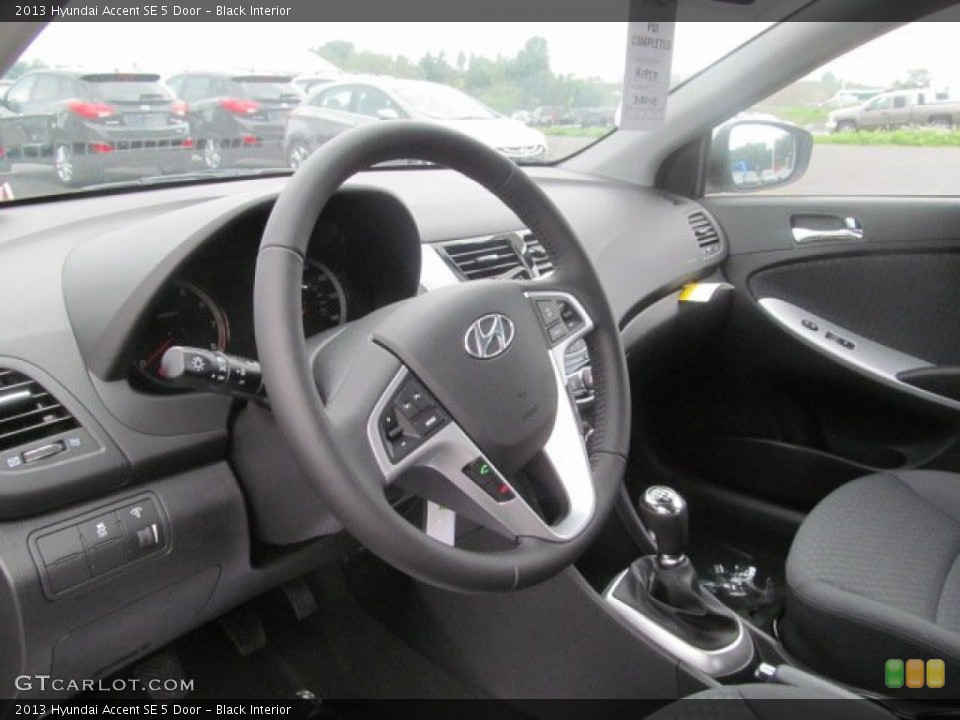 Black Interior Steering Wheel for the 2013 Hyundai Accent SE 5 Door #68460428