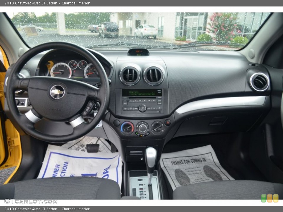 Charcoal Interior Dashboard for the 2010 Chevrolet Aveo LT Sedan #68518213