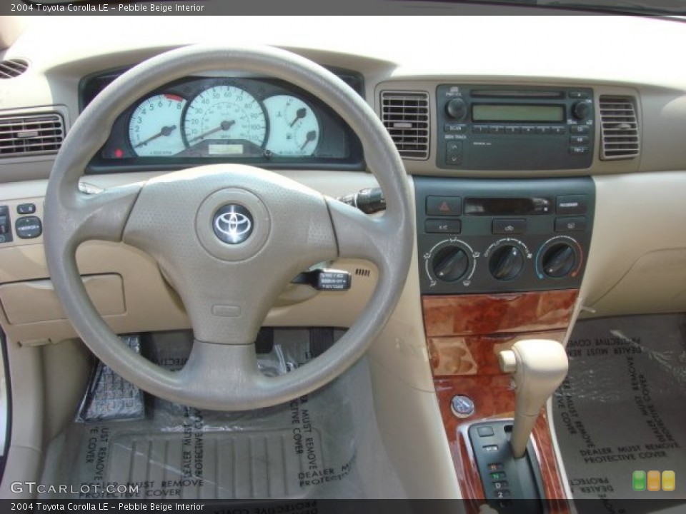 Pebble Beige Interior Dashboard for the 2004 Toyota Corolla LE #68596545