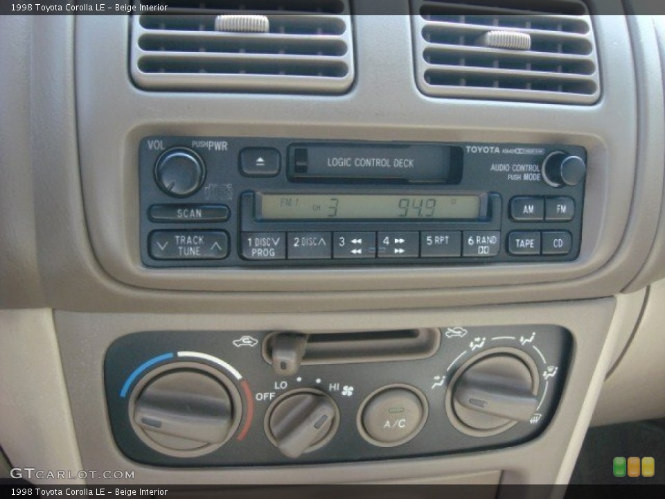 Beige Interior Audio System for the 1998 Toyota Corolla LE #68597906