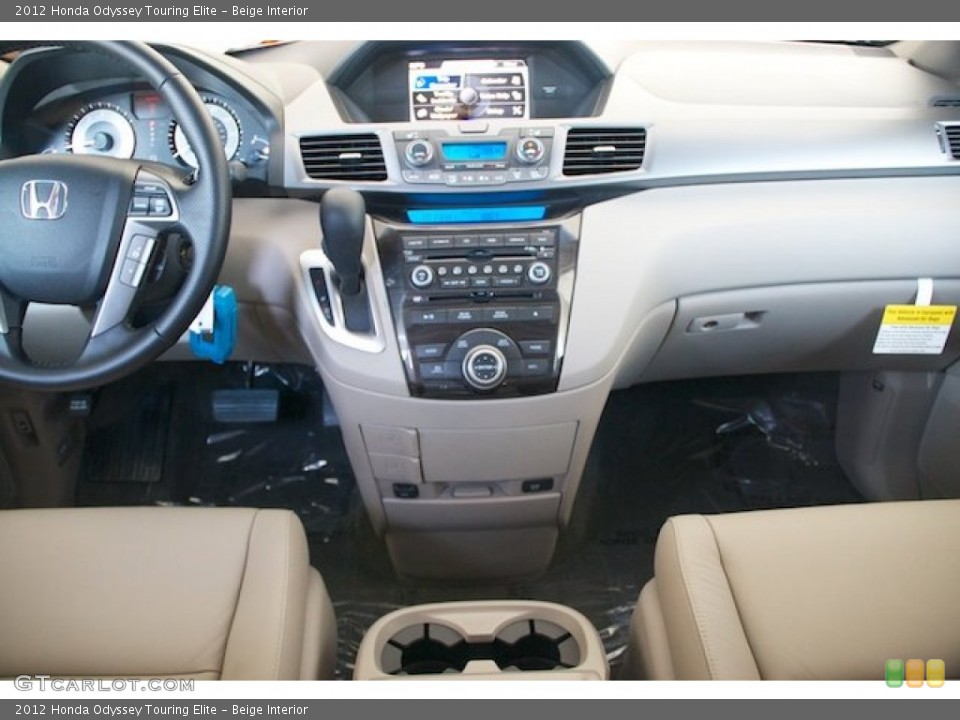 Beige Interior Dashboard for the 2012 Honda Odyssey Touring Elite #68668561