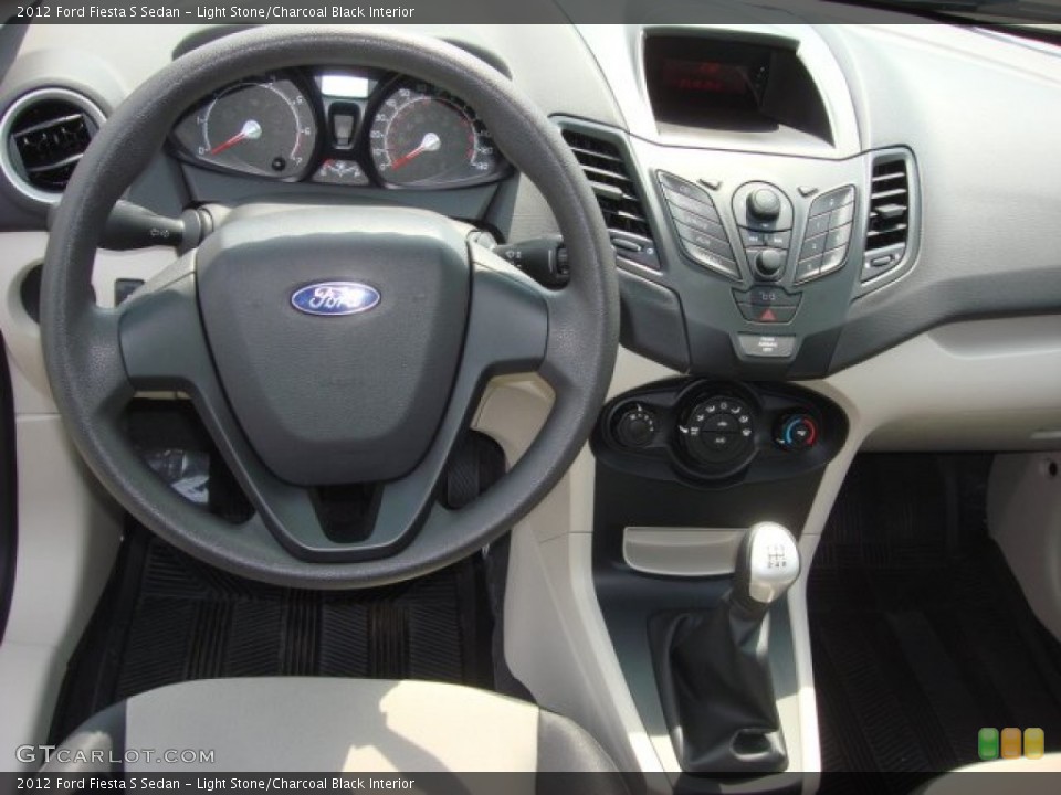 Light Stone/Charcoal Black Interior Dashboard for the 2012 Ford Fiesta S Sedan #68710138