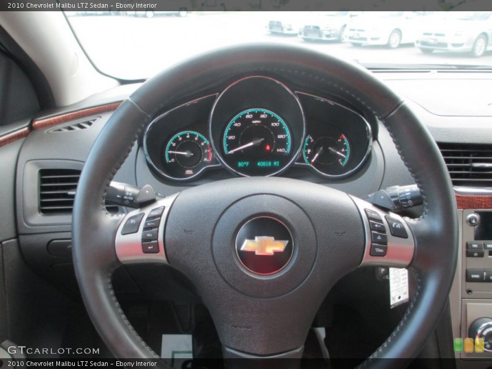 Ebony Interior Steering Wheel for the 2010 Chevrolet Malibu LTZ Sedan #68804211