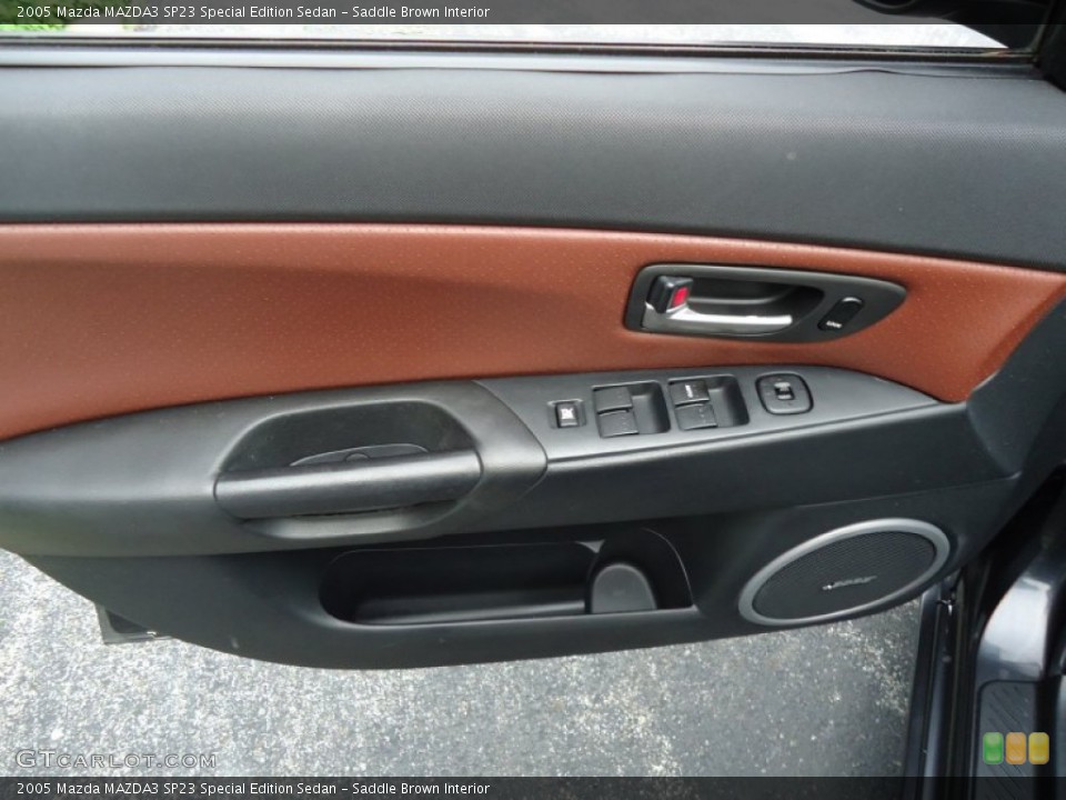 Saddle Brown Interior Door Panel for the 2005 Mazda MAZDA3 SP23 Special Edition Sedan #68831124
