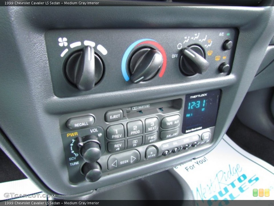 Medium Gray Interior Controls for the 1999 Chevrolet Cavalier LS Sedan #68843457
