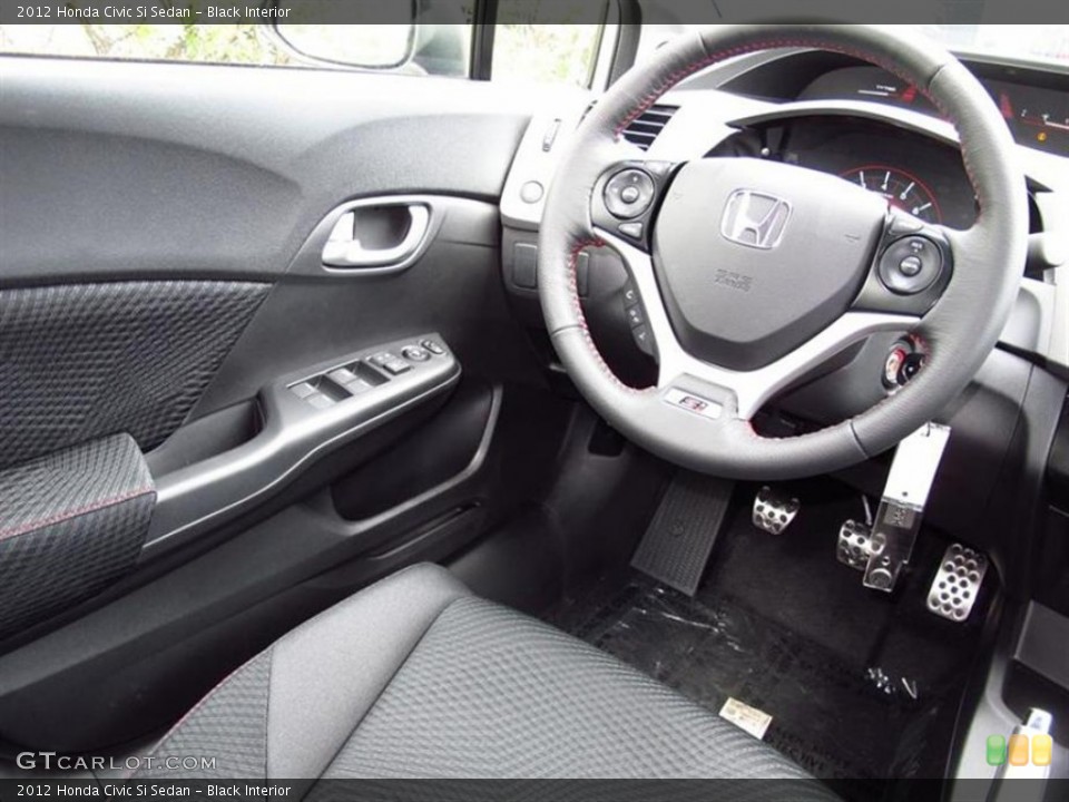 Black Interior Steering Wheel for the 2012 Honda Civic Si Sedan #68864949