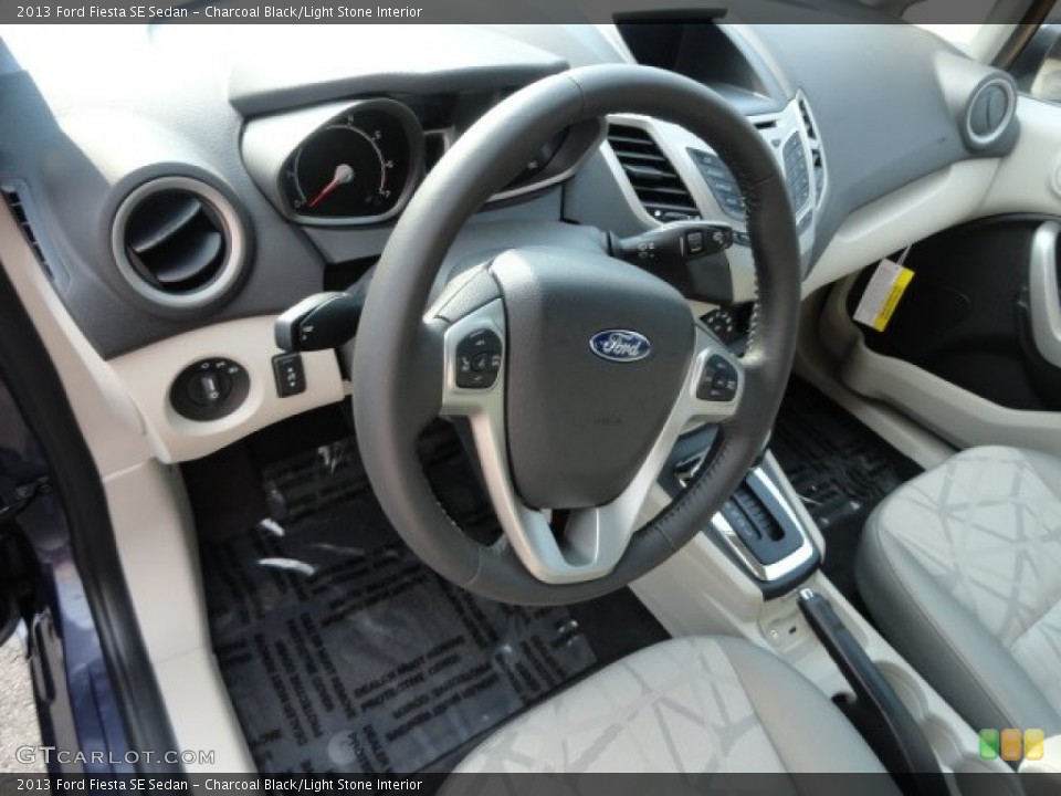 Charcoal Black/Light Stone Interior Steering Wheel for the 2013 Ford Fiesta SE Sedan #68887716