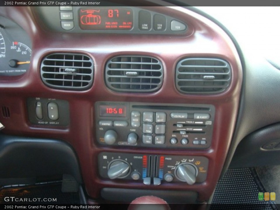 Ruby Red Interior Controls for the 2002 Pontiac Grand Prix GTP Coupe #68934948