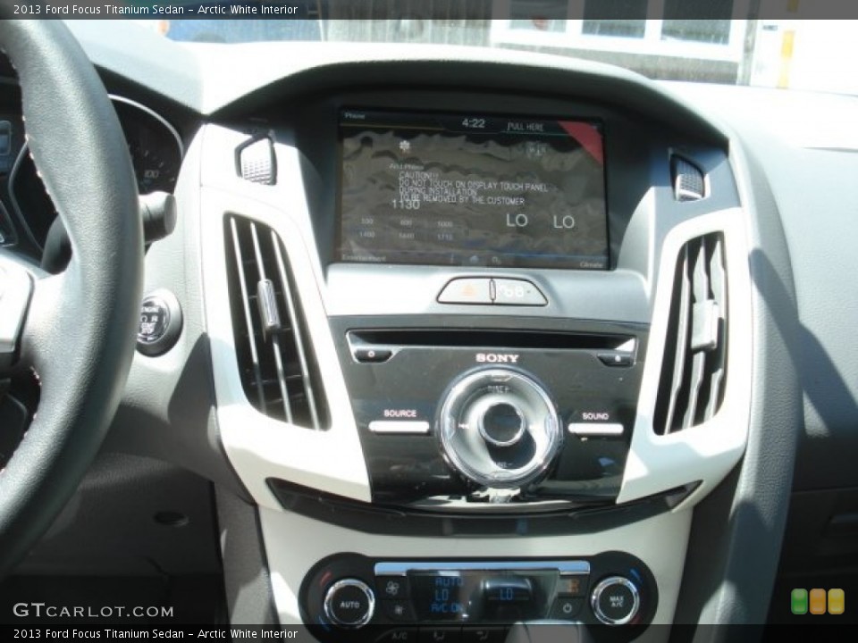 Arctic White Interior Controls for the 2013 Ford Focus Titanium Sedan #69124328