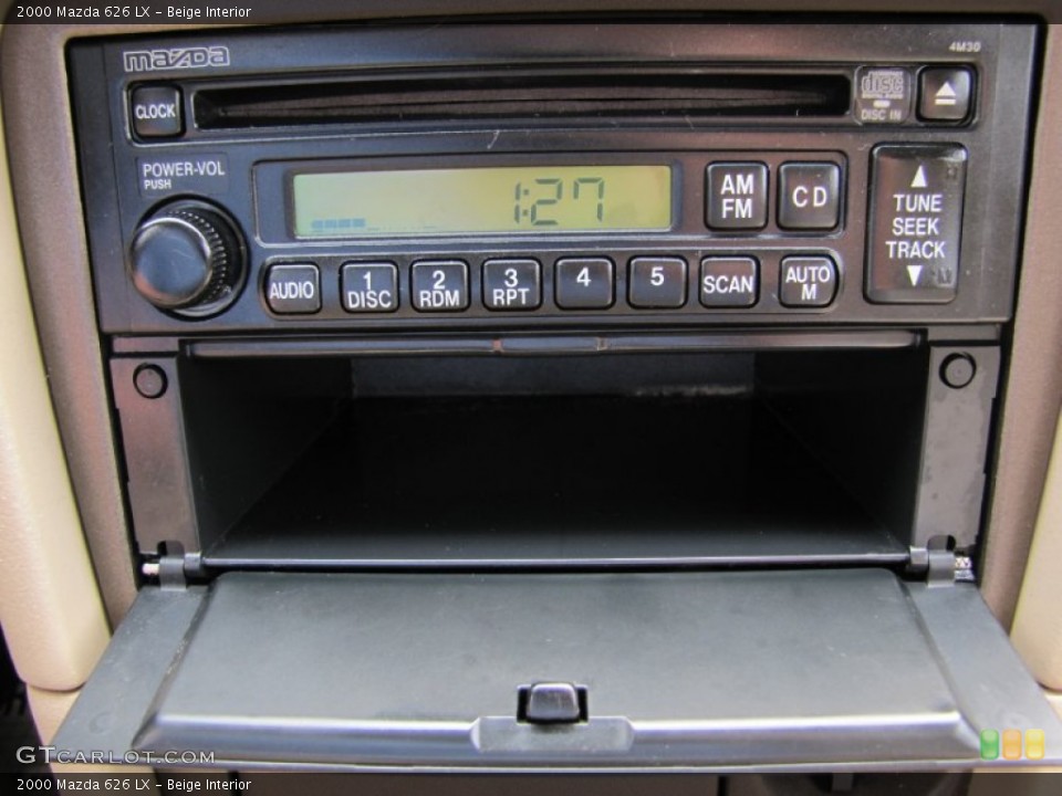 Beige Interior Audio System for the 2000 Mazda 626 LX #69315078