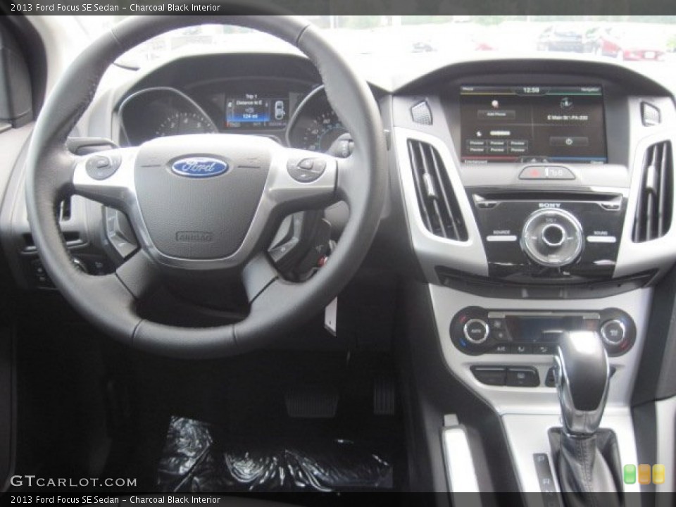 Charcoal Black Interior Dashboard for the 2013 Ford Focus SE Sedan #69398066