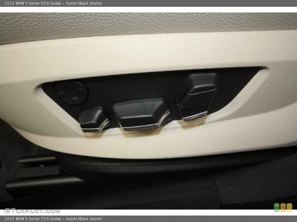 Oyster/Black Interior Controls for the 2013 BMW 5 Series 550i Sedan #69434380