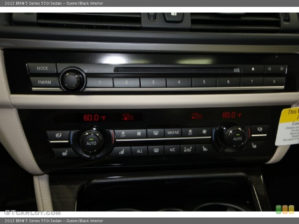 Oyster/Black Interior Controls for the 2013 BMW 5 Series 550i Sedan #69434398