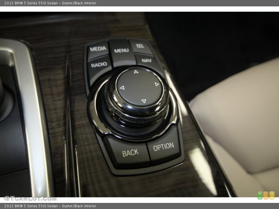 Oyster/Black Interior Controls for the 2013 BMW 5 Series 550i Sedan #69434416