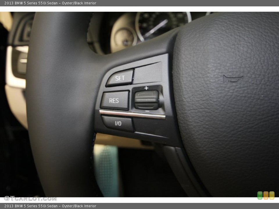 Oyster/Black Interior Controls for the 2013 BMW 5 Series 550i Sedan #69434446