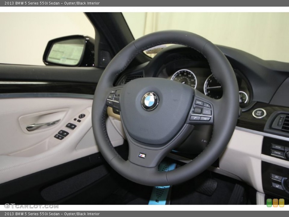 Oyster/Black Interior Steering Wheel for the 2013 BMW 5 Series 550i Sedan #69434479