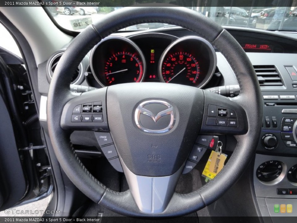 Black Interior Steering Wheel for the 2011 Mazda MAZDA3 s Sport 5 Door #69449503