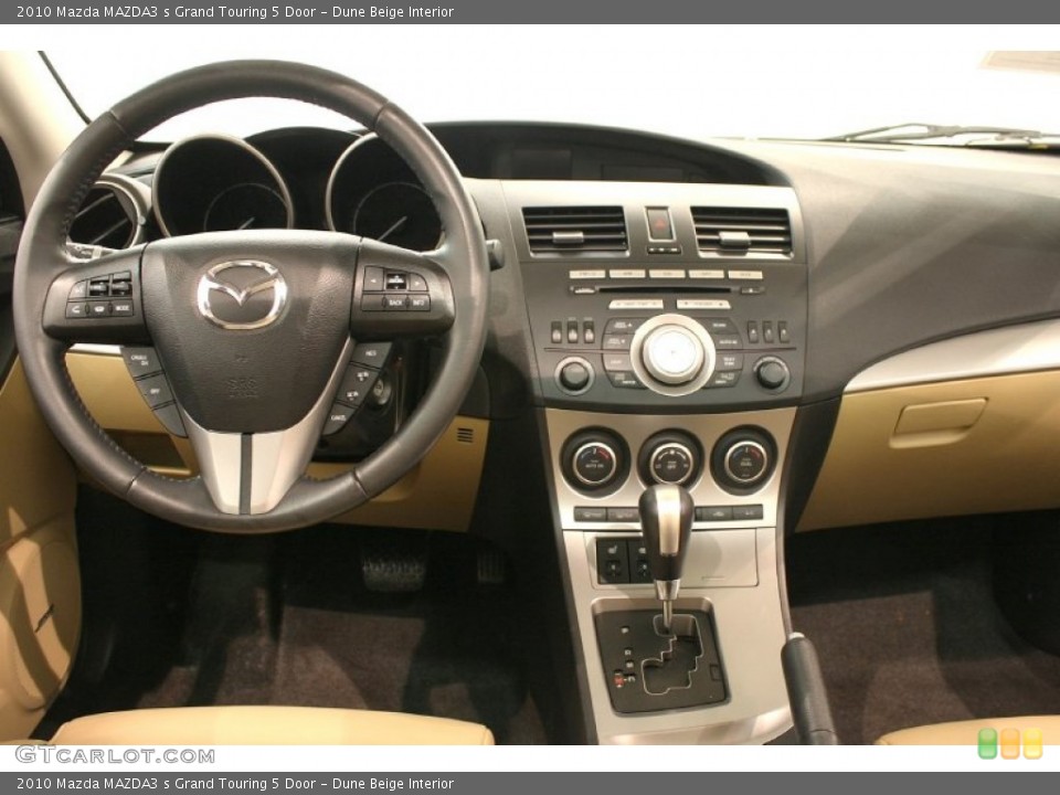 Dune Beige Interior Dashboard for the 2010 Mazda MAZDA3 s Grand Touring 5 Door #69645340