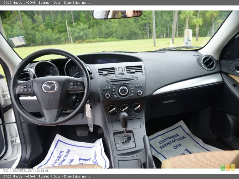 Dune Beige Interior Dashboard for the 2012 Mazda MAZDA3 i Touring 4 Door #69722619