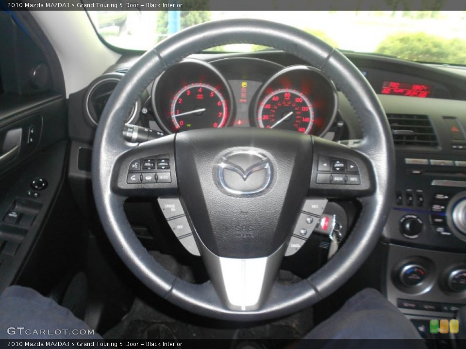 Black Interior Steering Wheel for the 2010 Mazda MAZDA3 s Grand Touring 5 Door #69746707