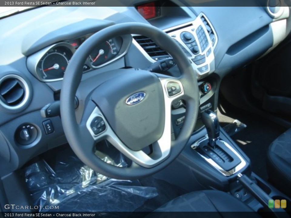 Charcoal Black Interior Steering Wheel for the 2013 Ford Fiesta SE Sedan #69867619