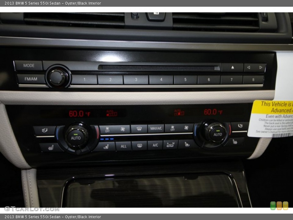 Oyster/Black Interior Controls for the 2013 BMW 5 Series 550i Sedan #69964291