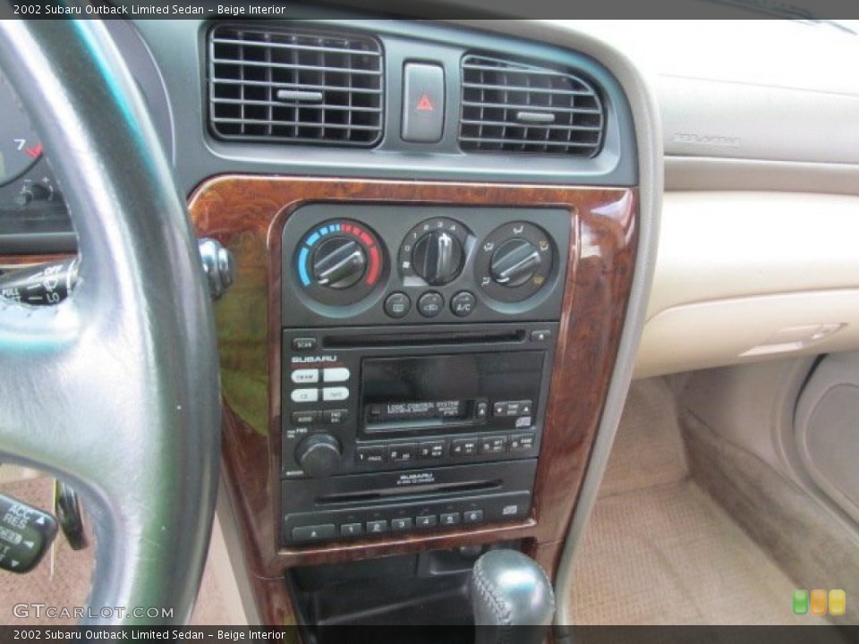Beige Interior Controls for the 2002 Subaru Outback Limited Sedan #70141215