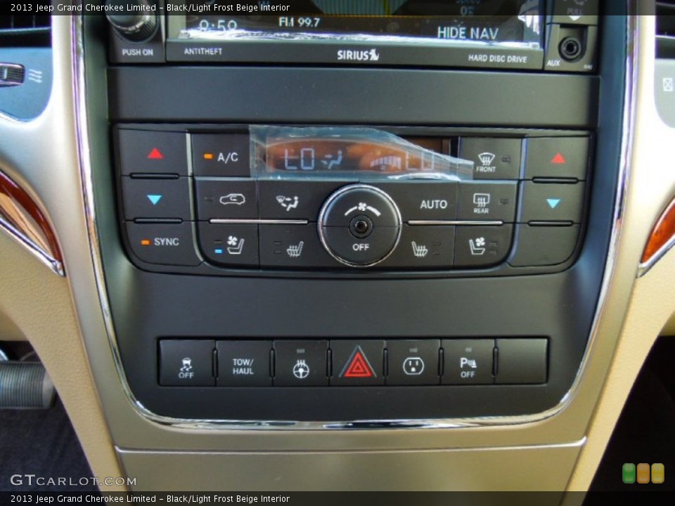 Black/Light Frost Beige Interior Controls for the 2013 Jeep Grand Cherokee Limited #70259869