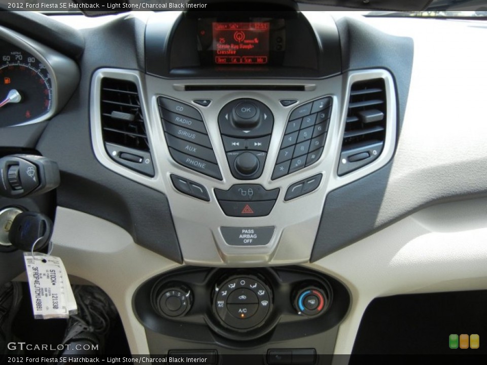 Light Stone/Charcoal Black Interior Controls for the 2012 Ford Fiesta SE Hatchback #70314288