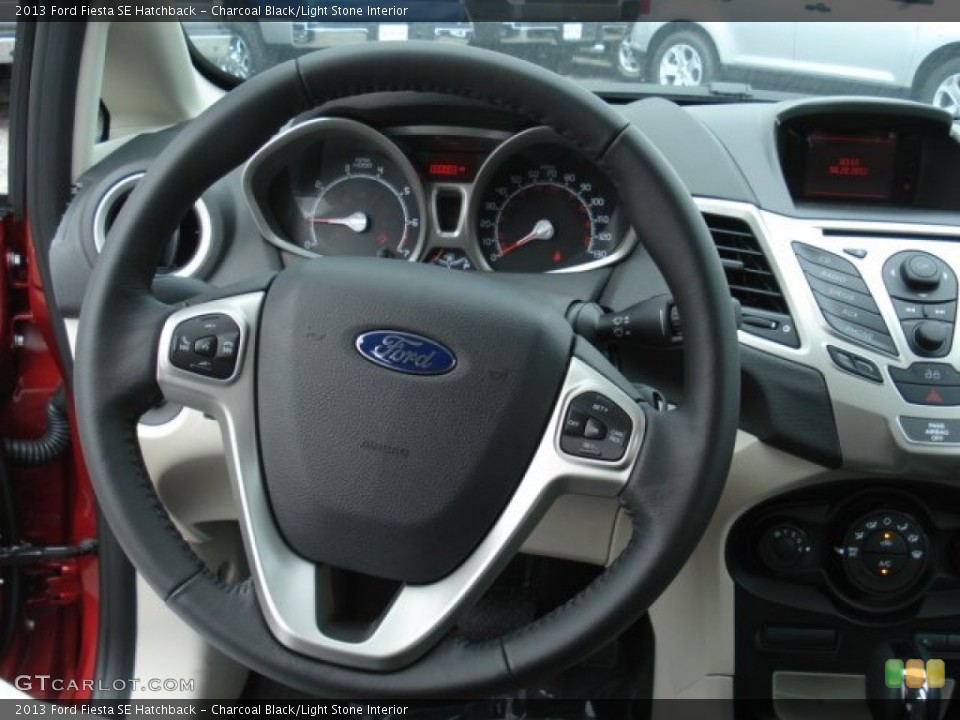 Charcoal Black/Light Stone Interior Steering Wheel for the 2013 Ford Fiesta SE Hatchback #70331694