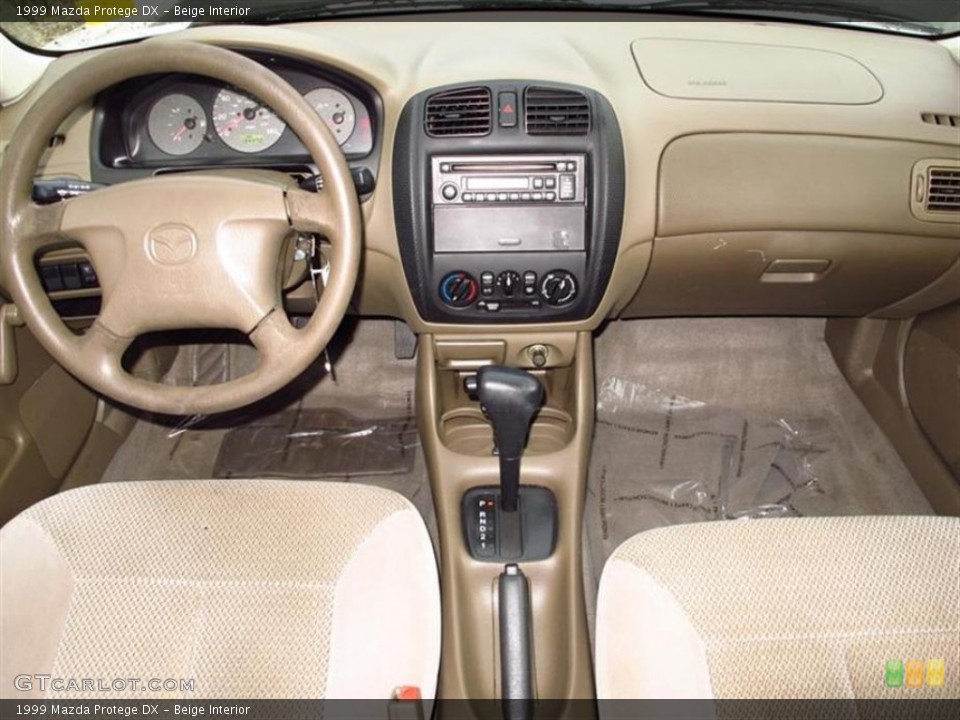 Beige Interior Dashboard for the 1999 Mazda Protege DX #70858347