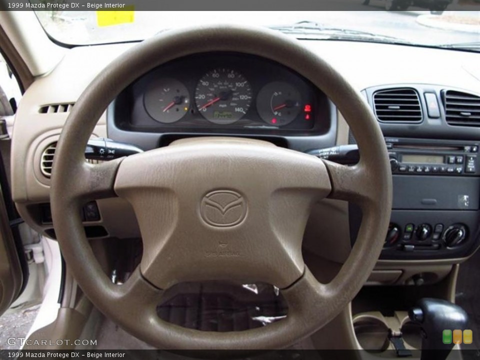Beige Interior Steering Wheel for the 1999 Mazda Protege DX #70858423