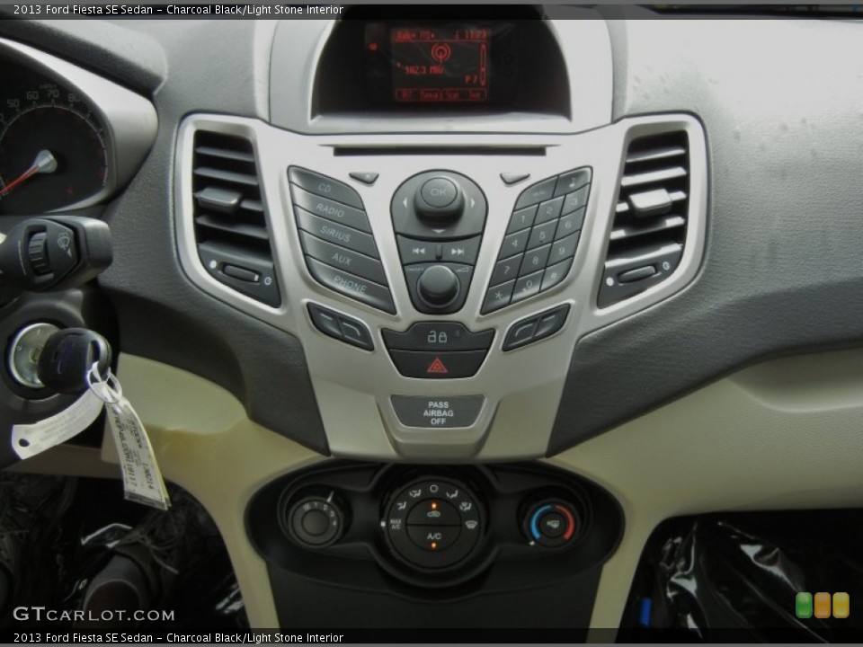 Charcoal Black/Light Stone Interior Controls for the 2013 Ford Fiesta SE Sedan #70967698