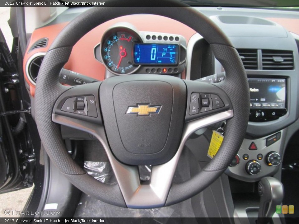 Jet Black/Brick Interior Steering Wheel for the 2013 Chevrolet Sonic LT Hatch #70974529