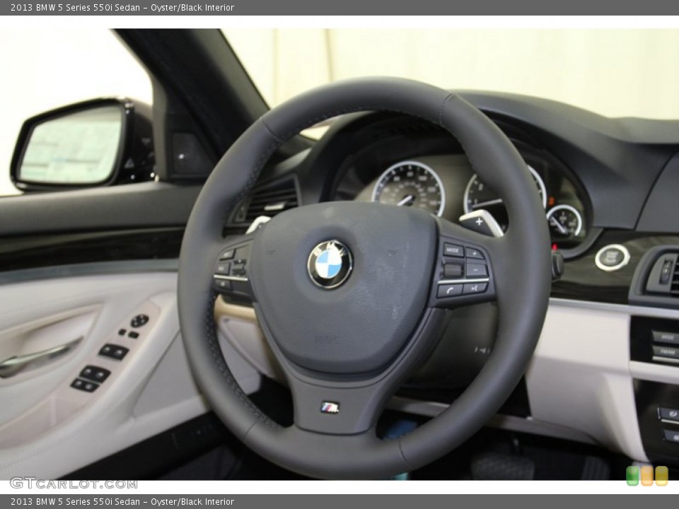 Oyster/Black Interior Steering Wheel for the 2013 BMW 5 Series 550i Sedan #71093345