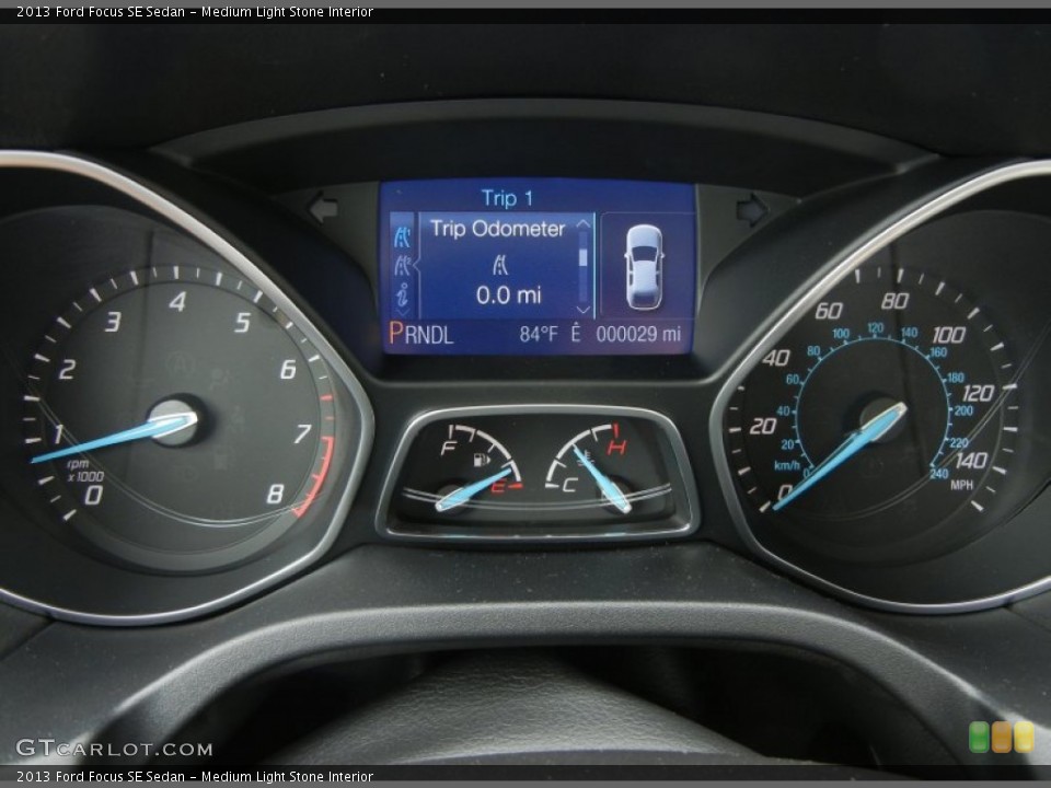 Medium Light Stone Interior Gauges for the 2013 Ford Focus SE Sedan #71283013