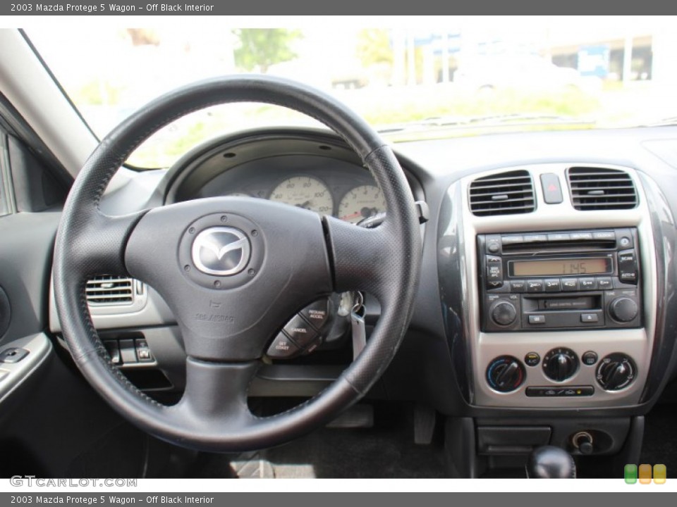 Off Black Interior Dashboard for the 2003 Mazda Protege 5 Wagon #71414611