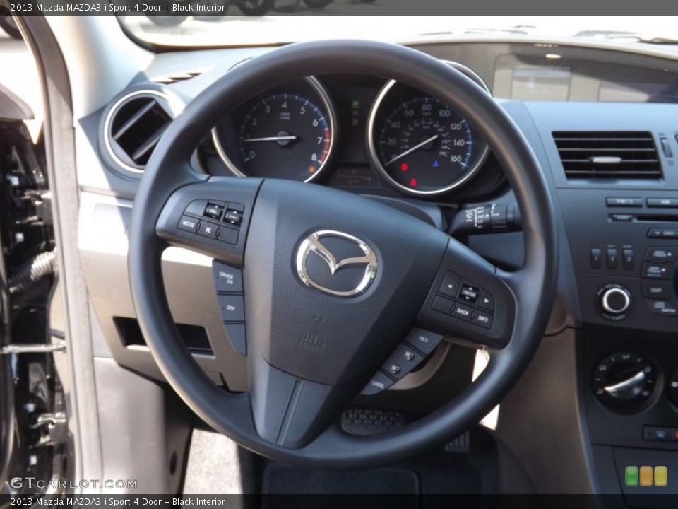 Black Interior Steering Wheel for the 2013 Mazda MAZDA3 i Sport 4 Door #71637445