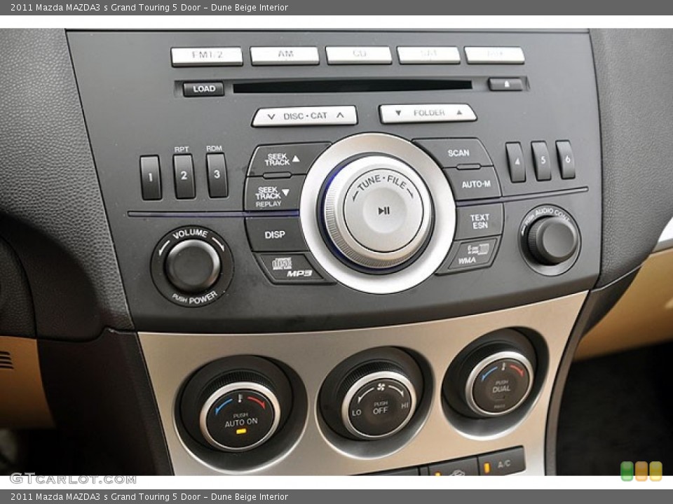 Dune Beige Interior Controls for the 2011 Mazda MAZDA3 s Grand Touring 5 Door #71689778
